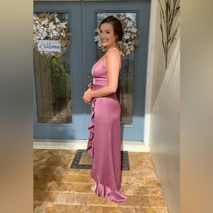 Celebrate brand formal high-low mauve colored dress with bow and ruffle accents